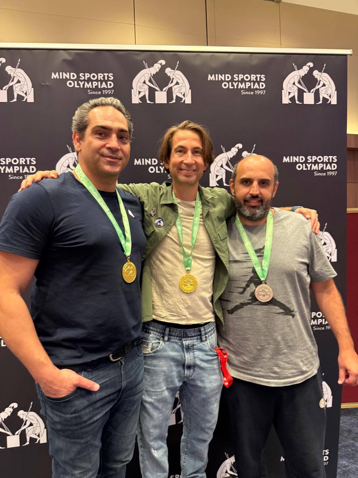 Ali Safa and Etan Ilfeld, joint 2026 MSO Backgammon Champions, with Nuno Torres, on the podium